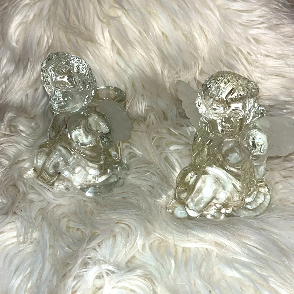 Set of 2 clear glass angel cherub candle holders. Frosted wings.